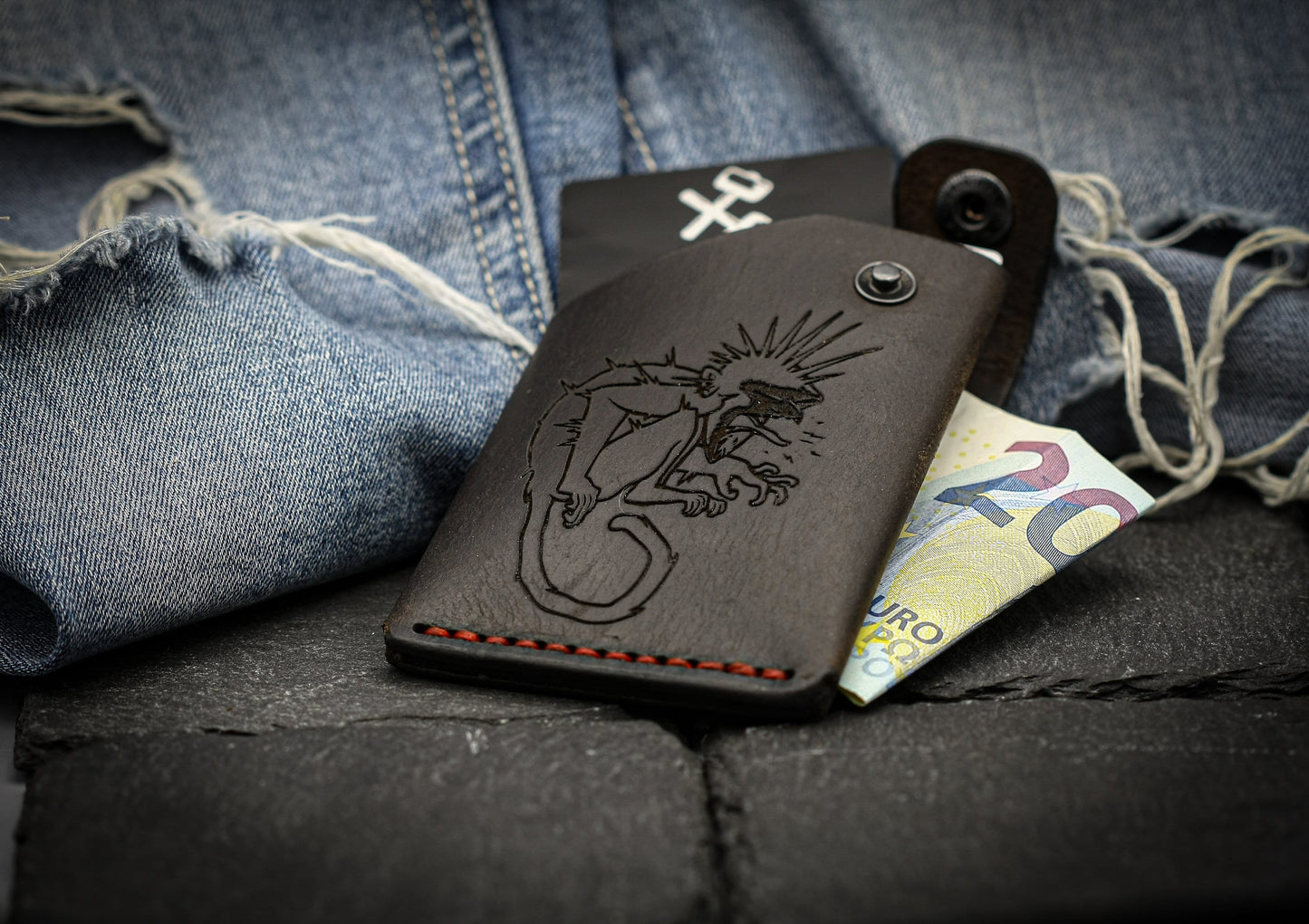 Leather wallet with monkey symbol.