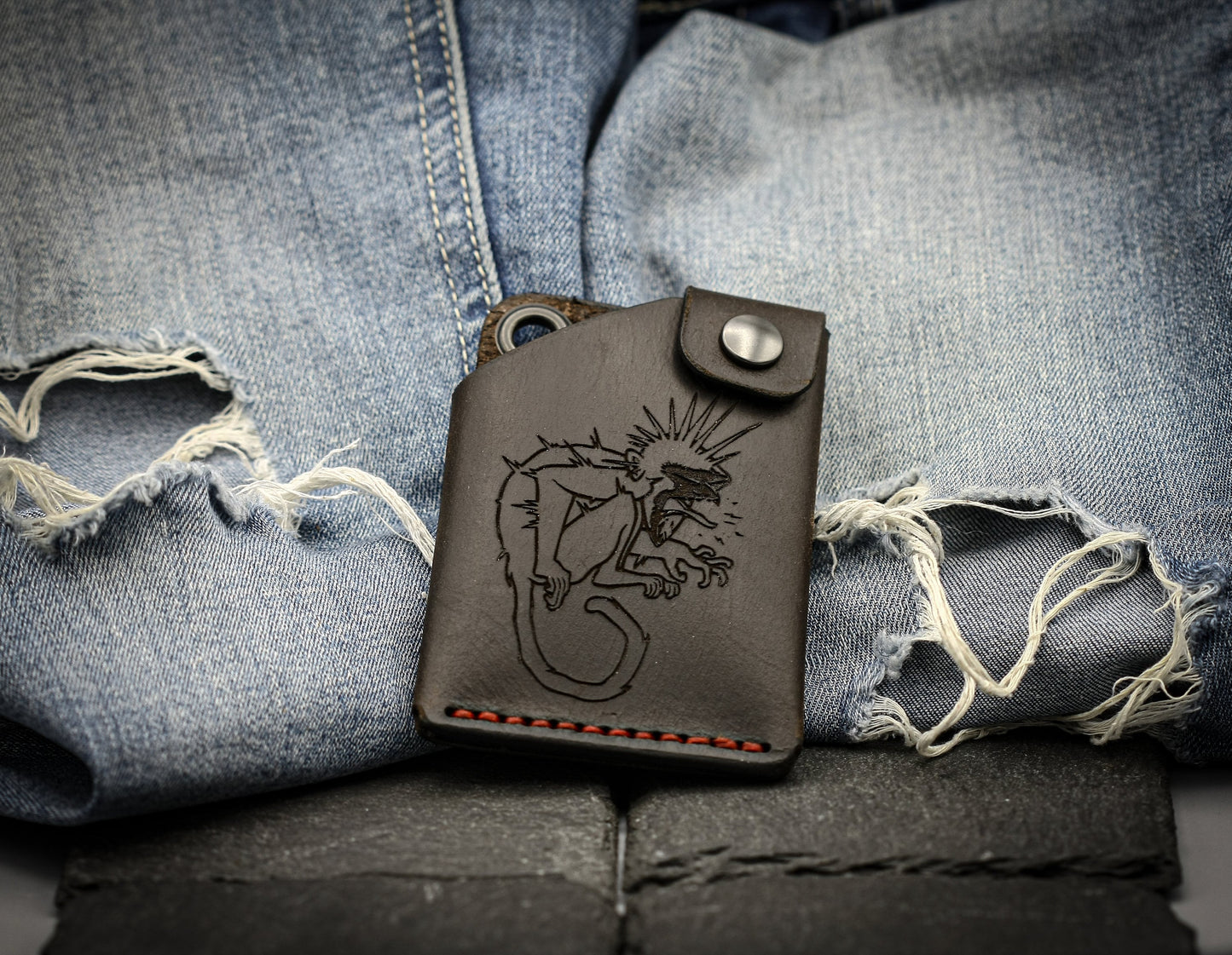 Leather wallet with monkey symbol.