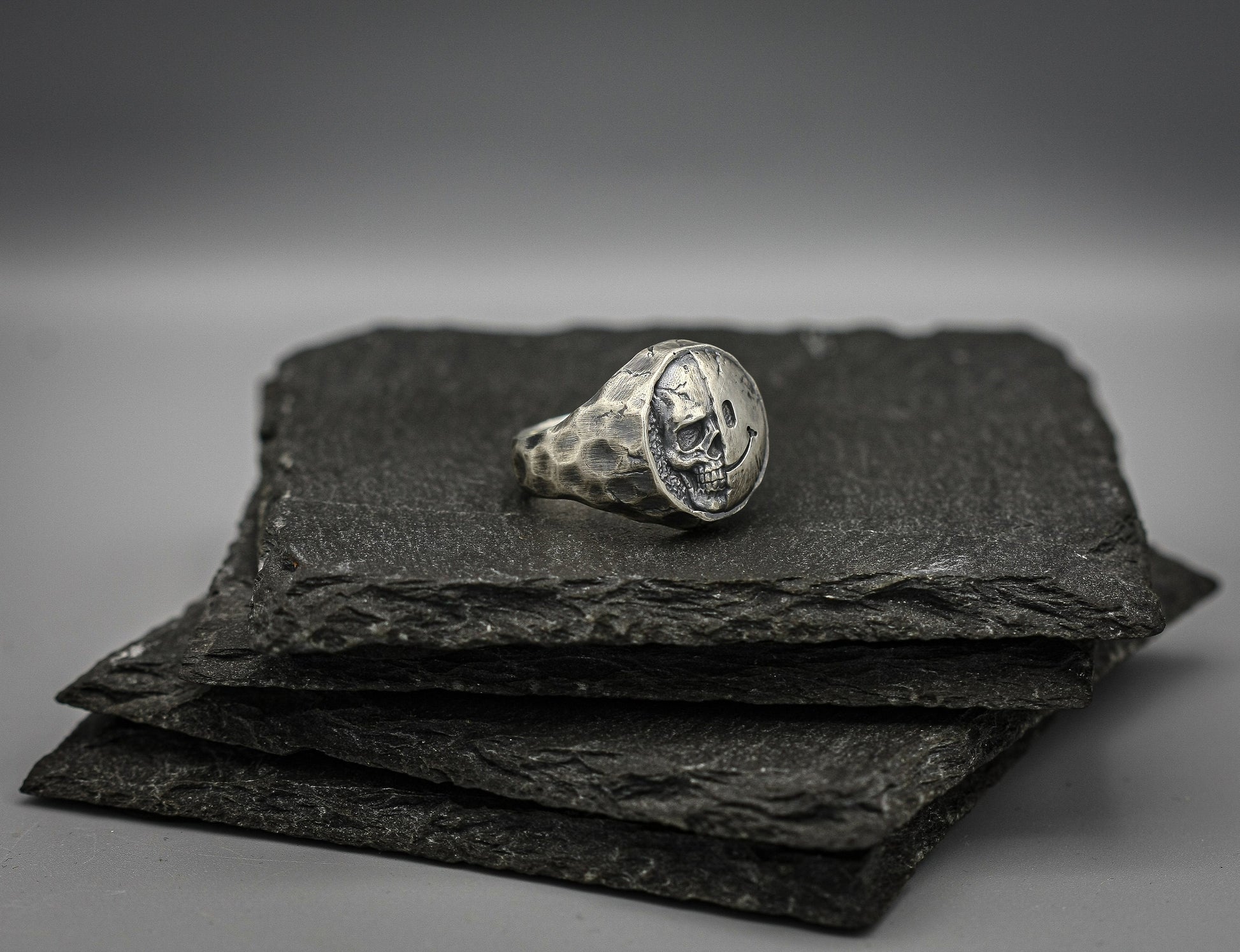 Half skull, half smile, round silver signet ring