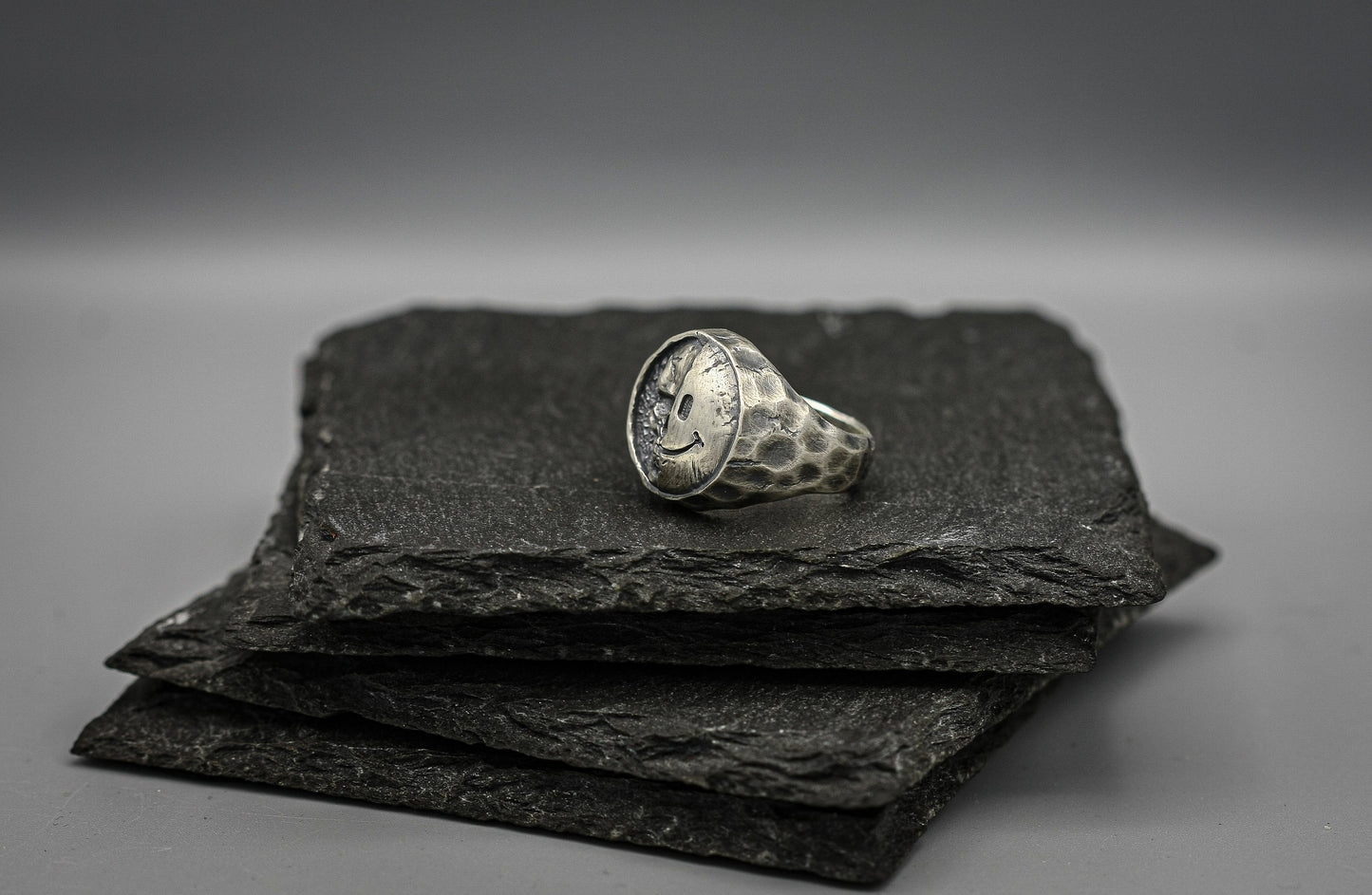 Half skull, half smile, round silver signet ring