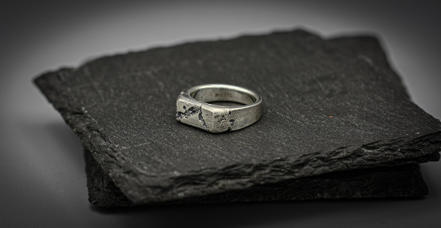 Rough fracture brutalist style band, silver signet ring