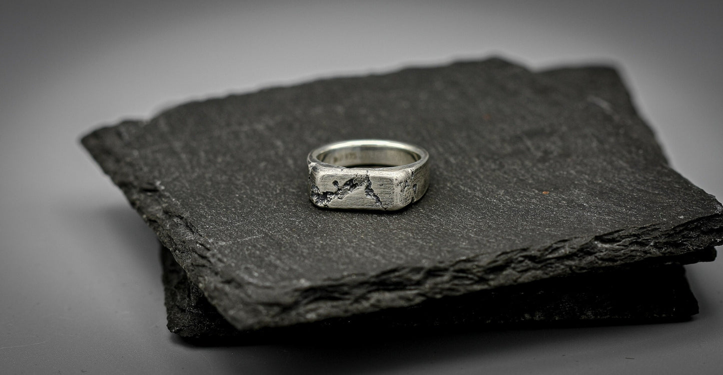 Rough fracture brutalist style band, silver signet ring