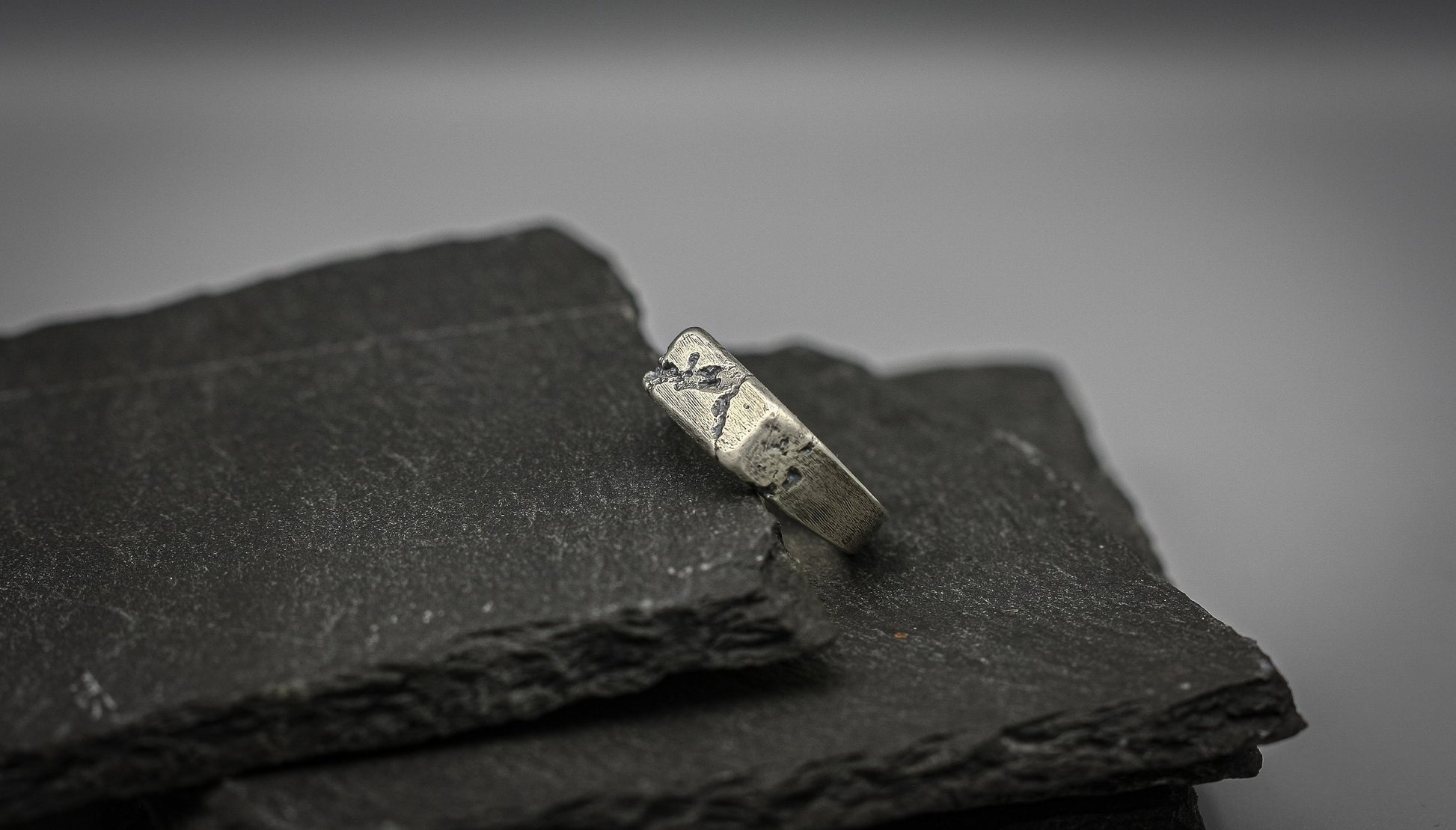 Rough fracture brutalist style band, silver signet ring