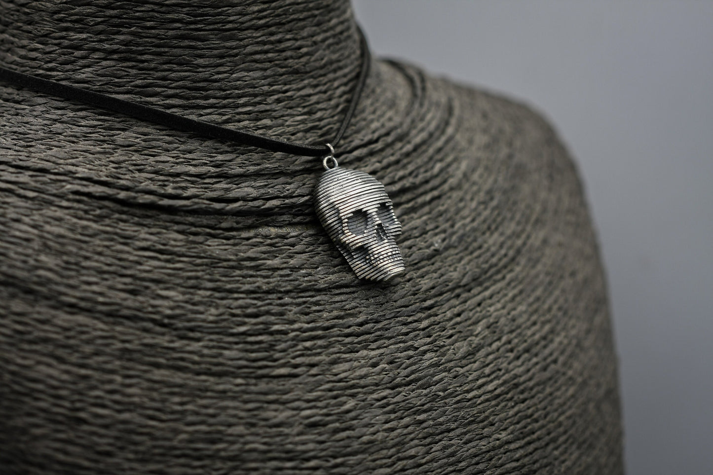 Sliced silver skull pendant.