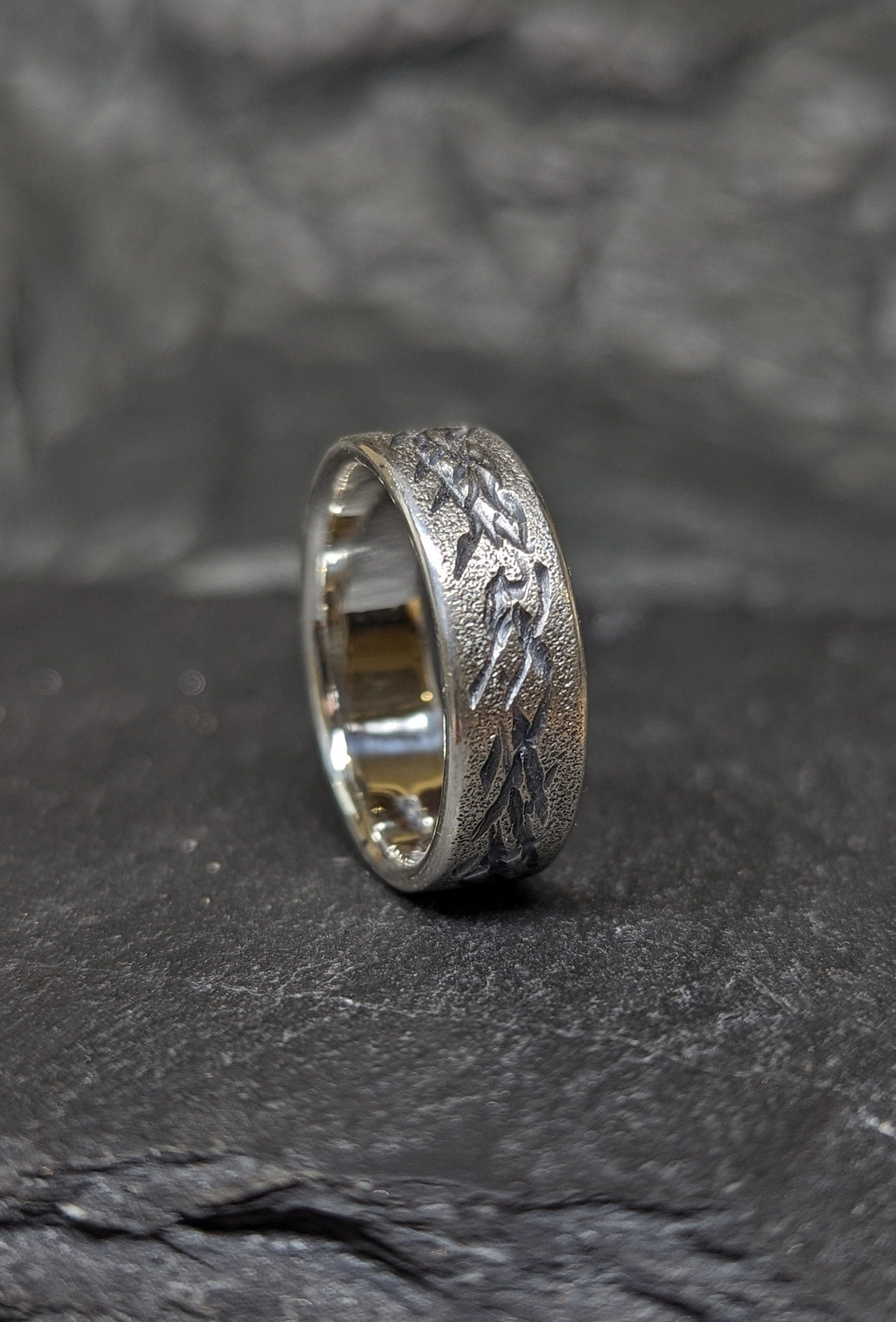 Distressed silver ring, scratched band