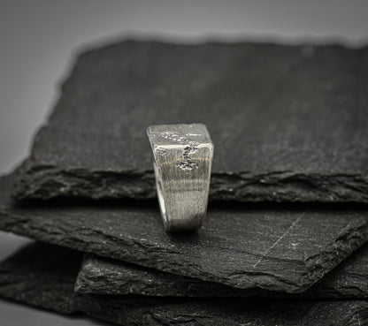 Rough fracture brutalist style band, silver signet ring