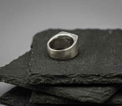 Rough fracture brutalist style band, silver signet ring