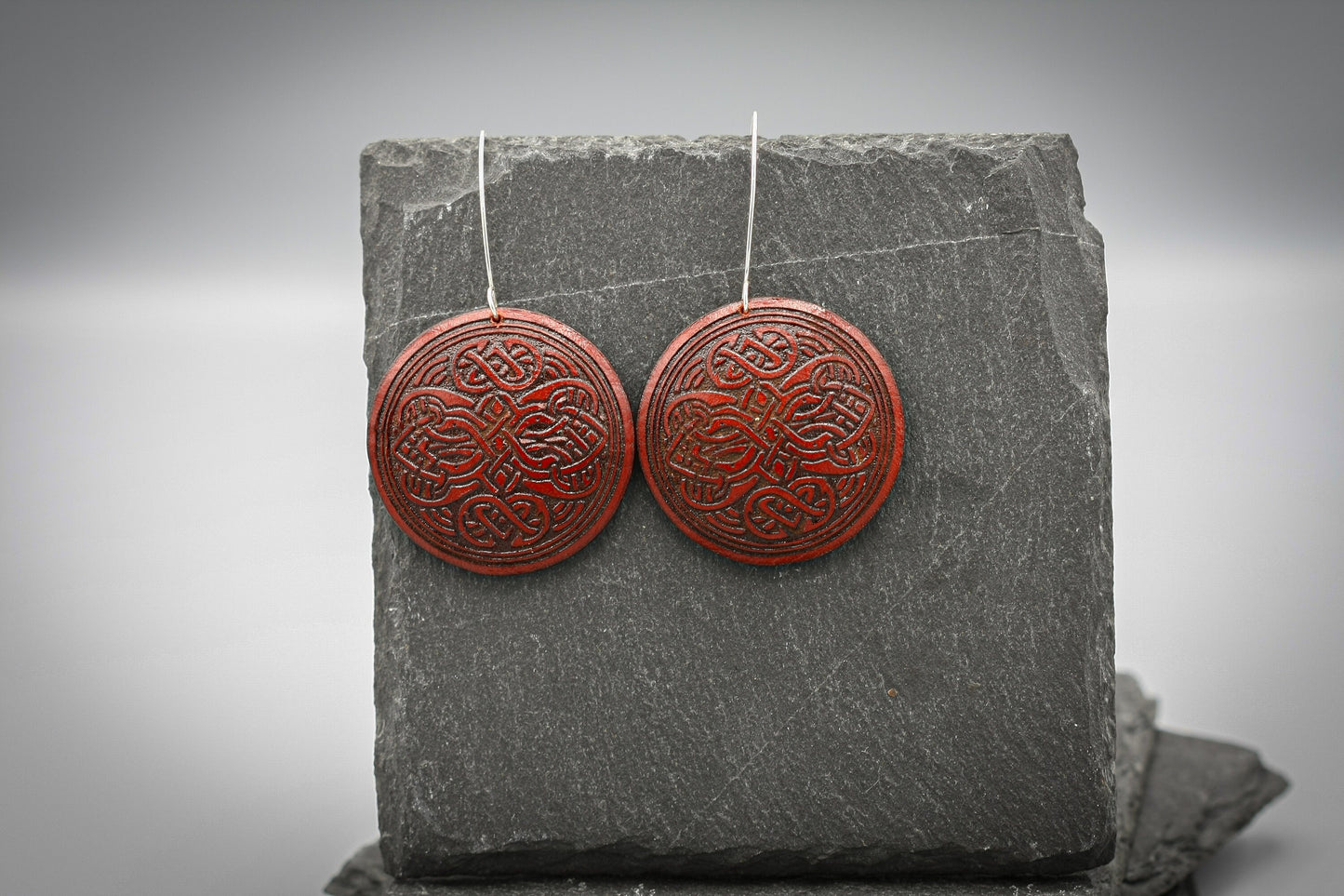 Red round leather Viking earrings, silver hook.