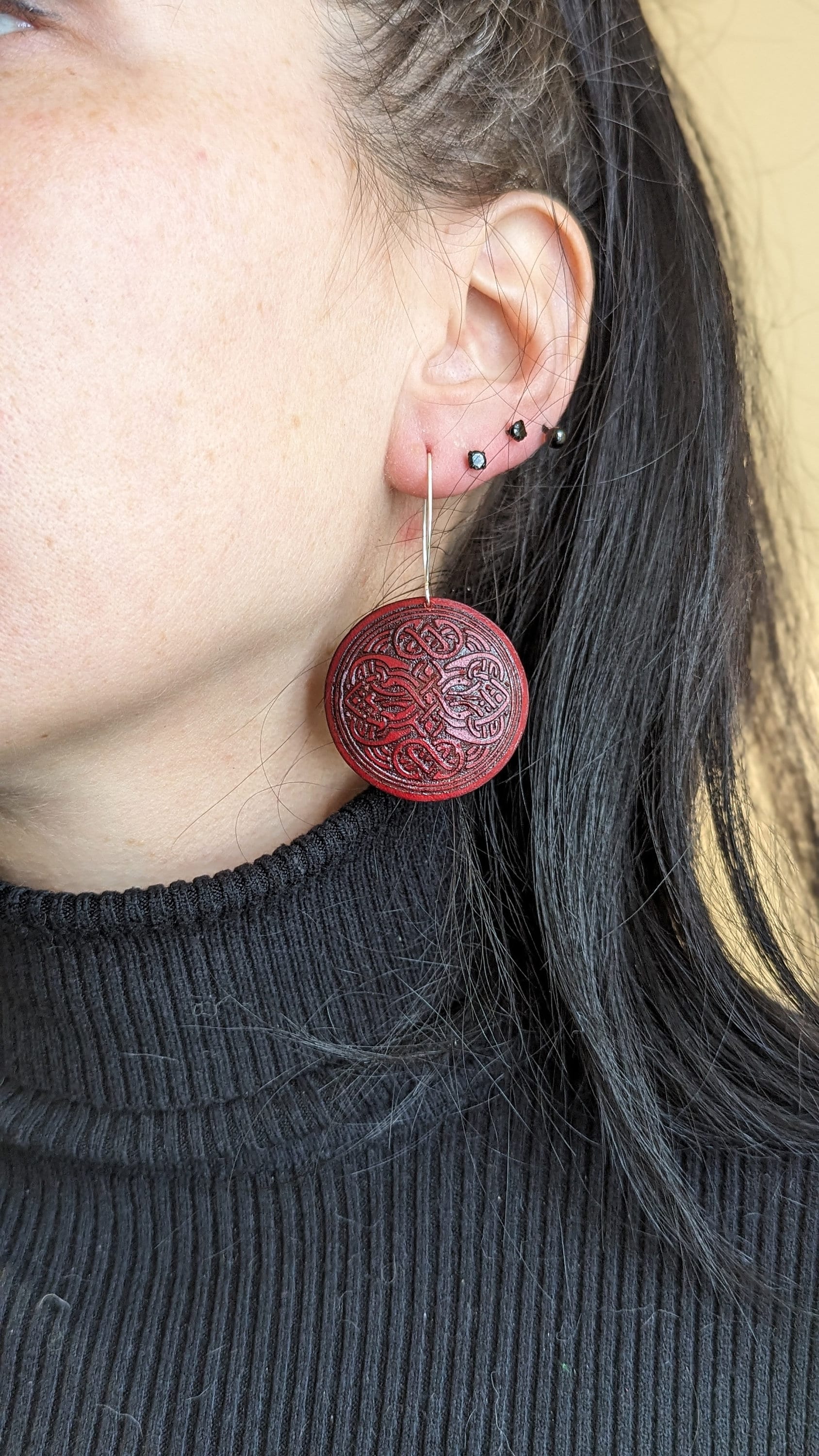 Red round leather Viking earrings, silver hook.